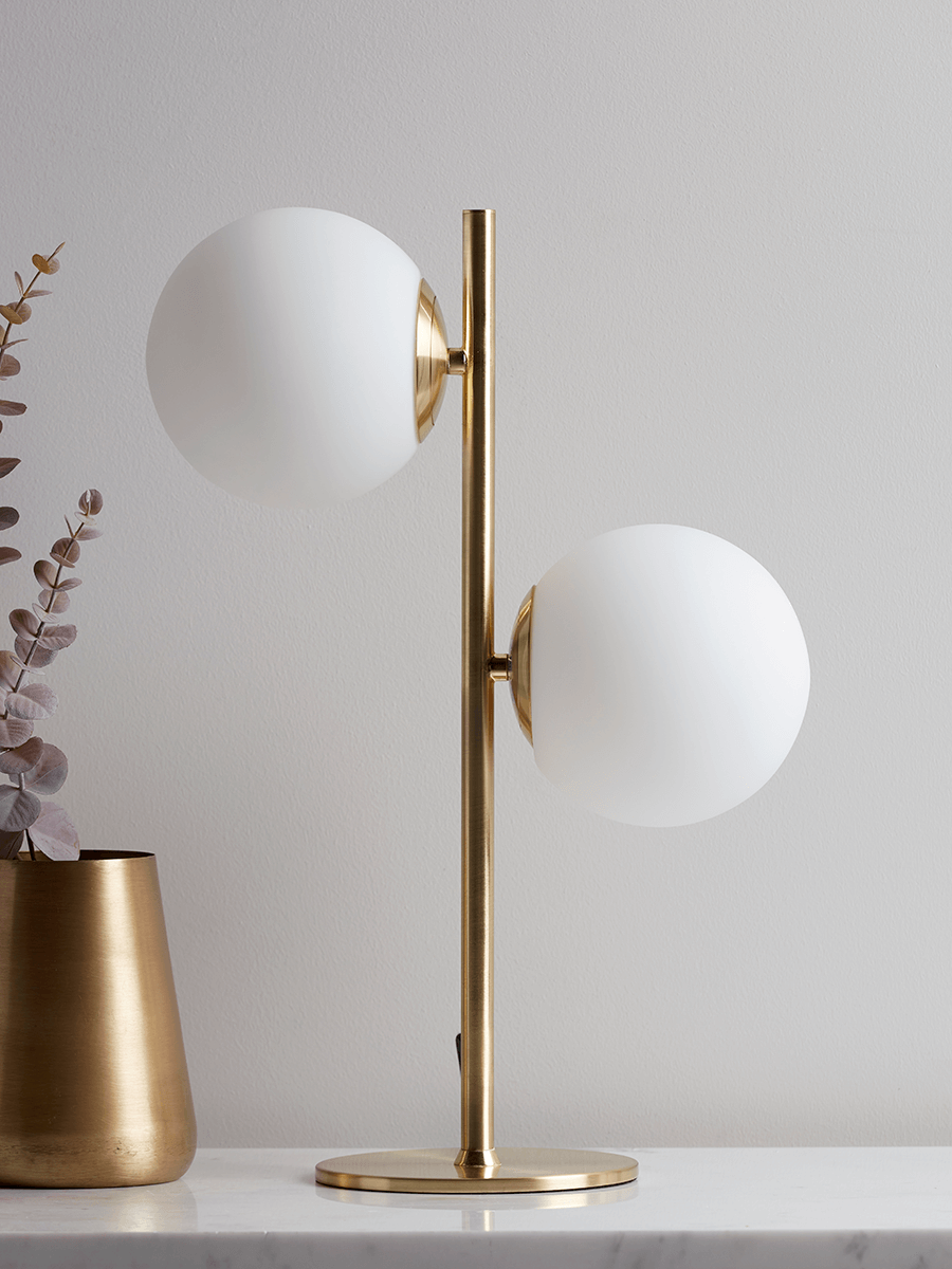 Product photograph of White Brass Globe Deco Table Lamp from Cox and Cox