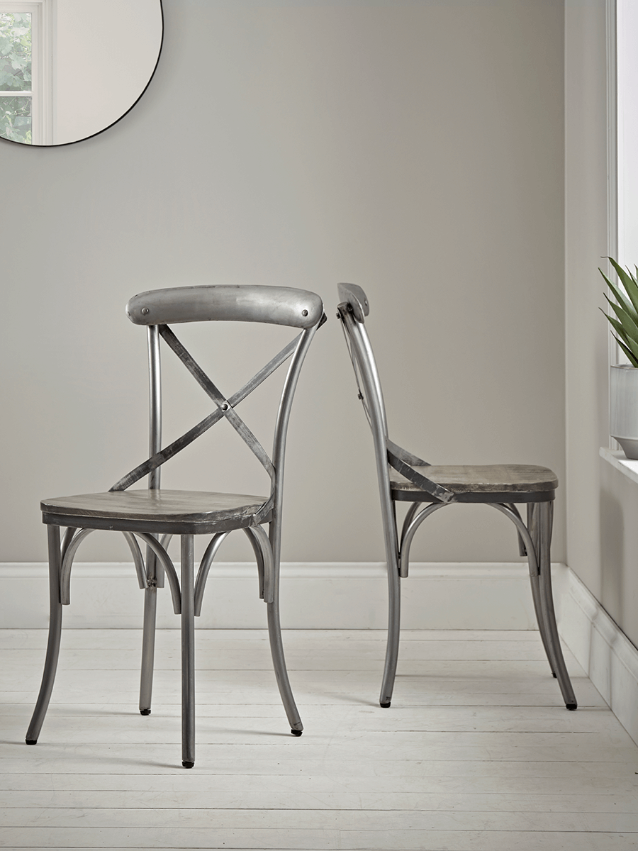 

Two Antique Zinc Cross Back Chairs