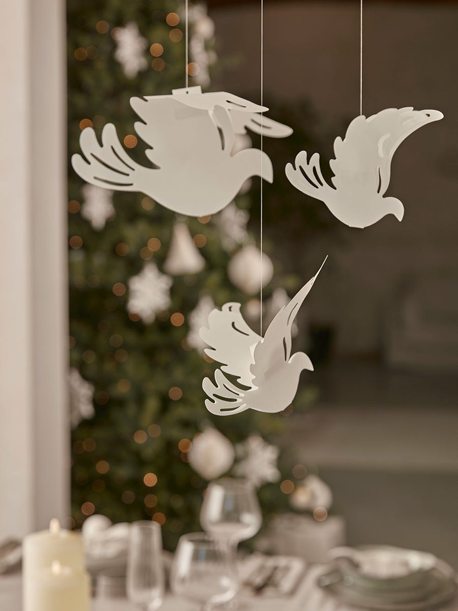 Photo of Three hanging paper doves