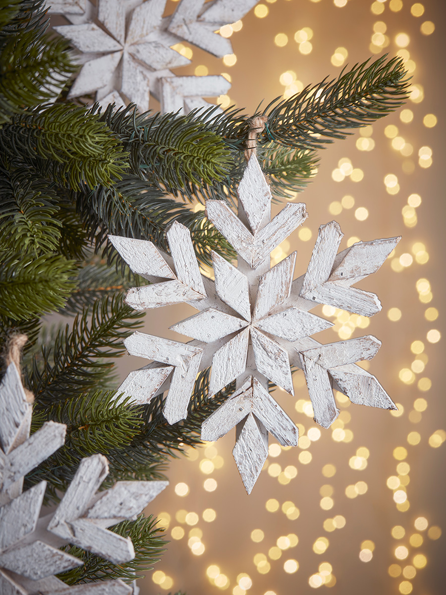 Photo of Three wooden snowflakes