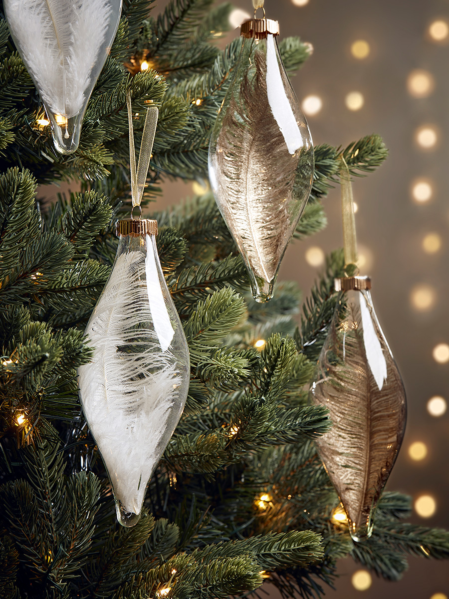 Photo of Four feather filled glass drops