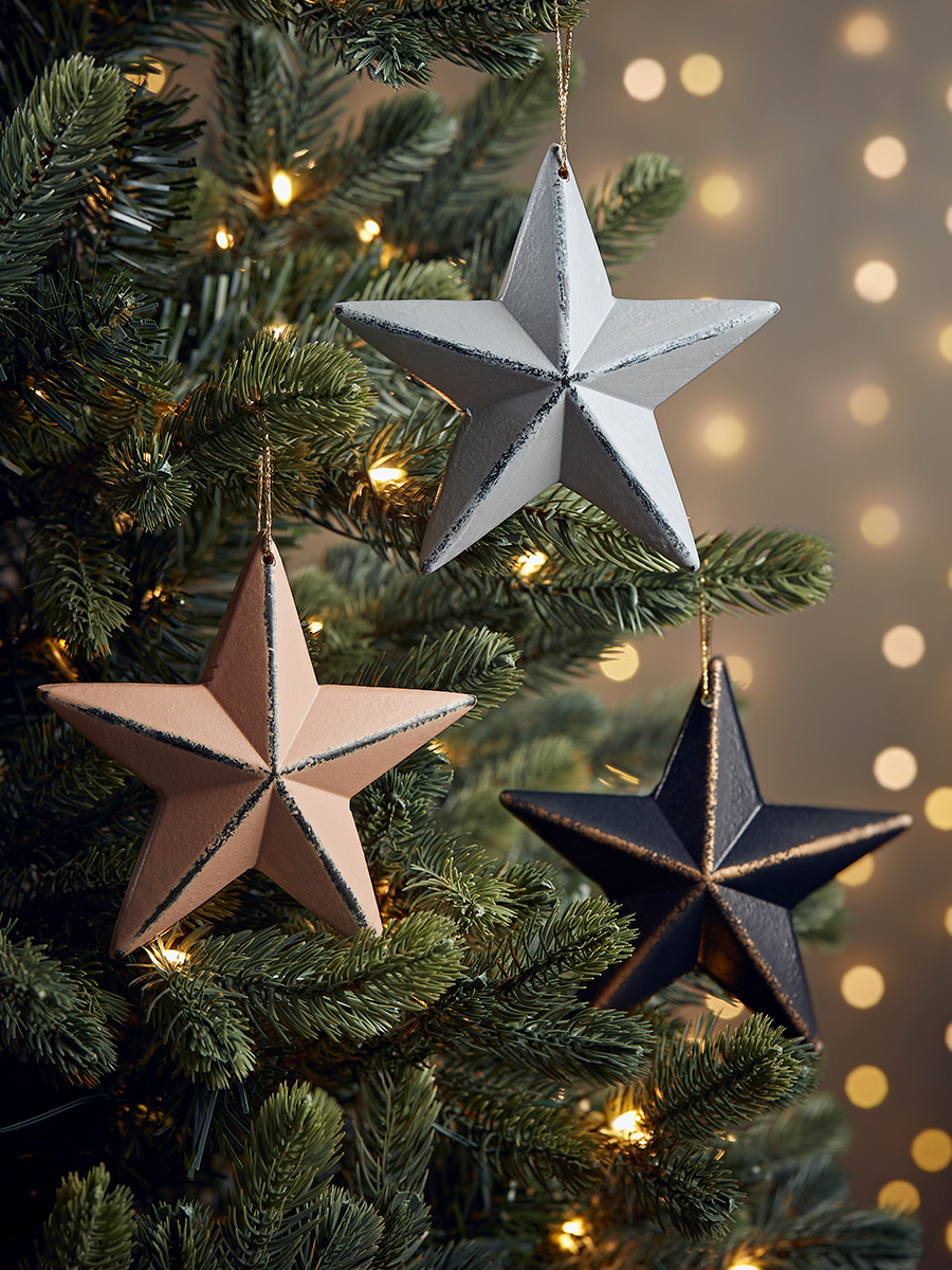 Photo of Three wooden hanging stars - scandi mix