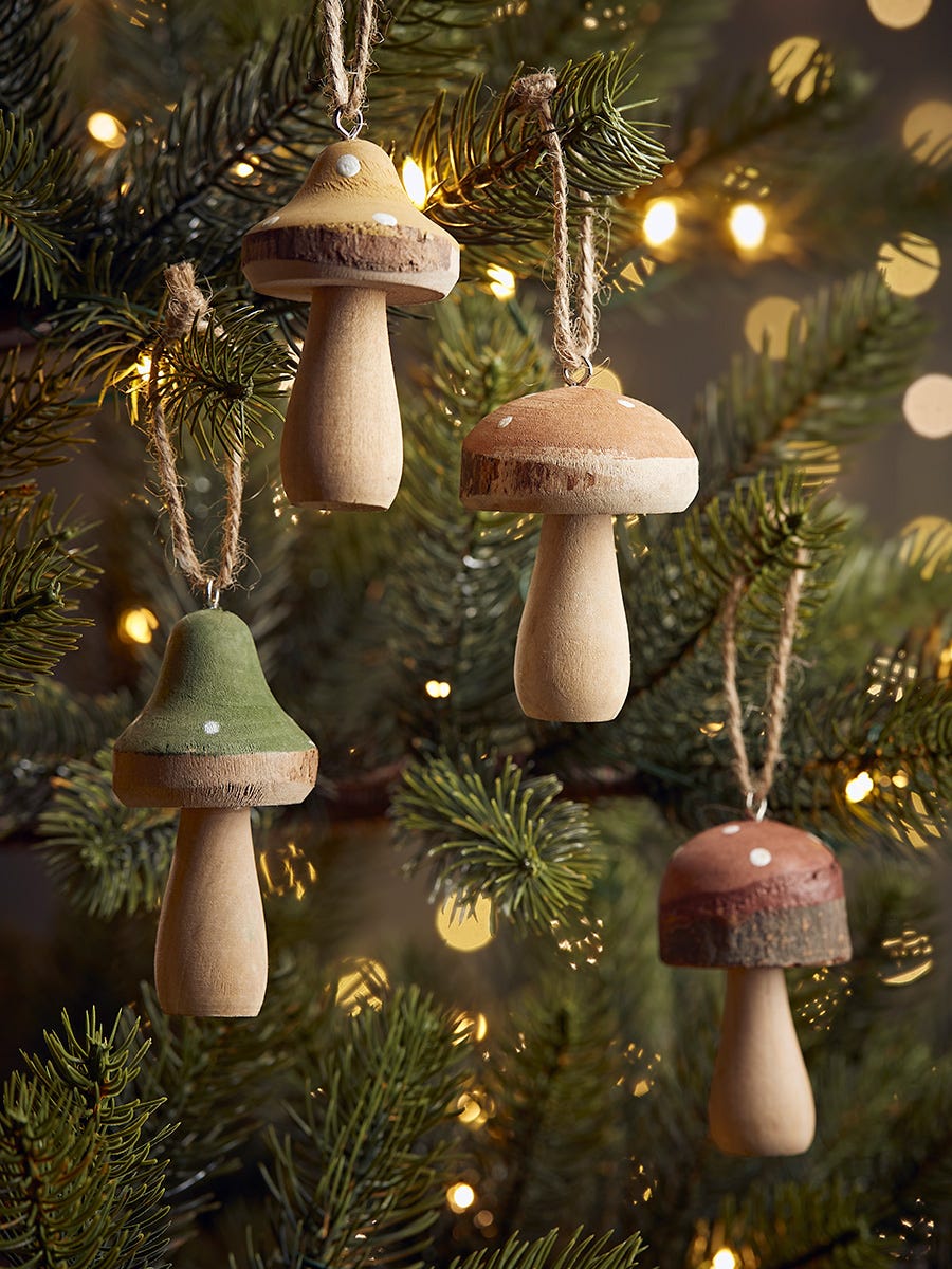 Photo of Four wooden hanging mushrooms