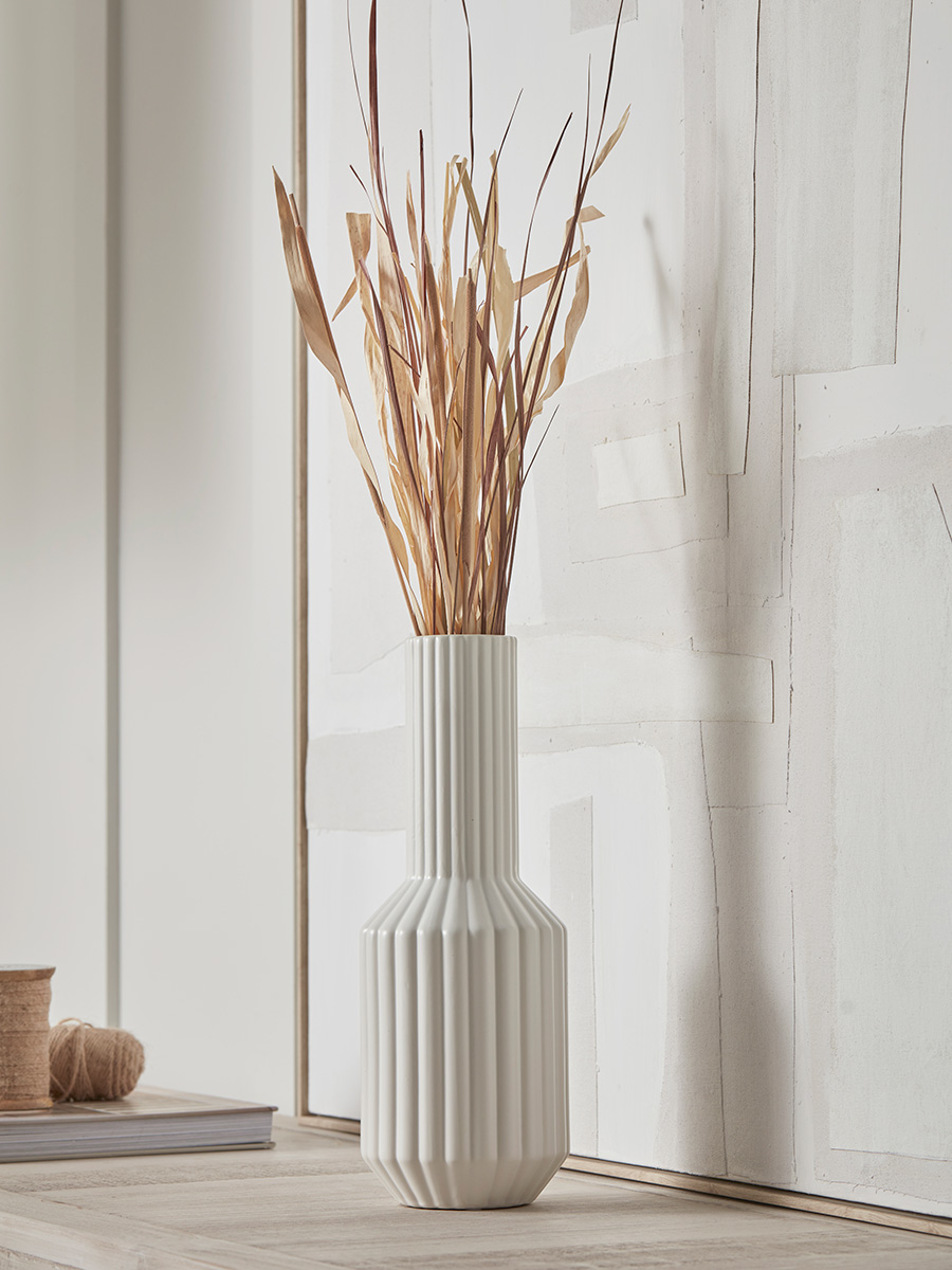 Photo of Ribbed tall bottle vase