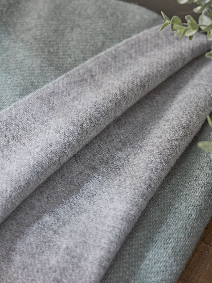 Product photograph of Soft Wool Reversible Throw - Sage Grey from Cox and Cox.