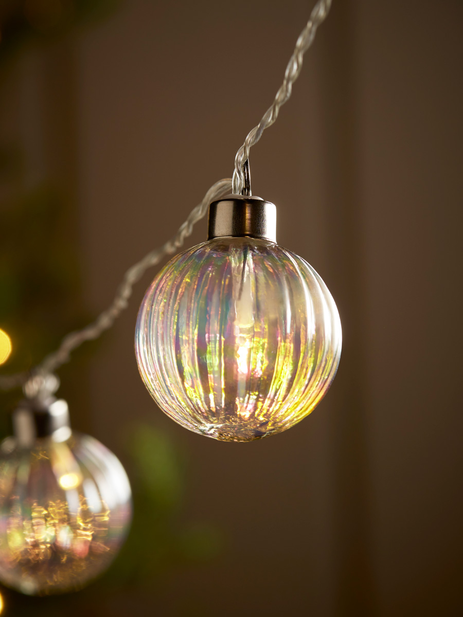 Product photograph of Iridescent Fluted Glass Bauble String Lights from Cox and Cox.