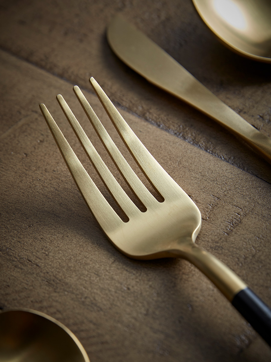 Product photograph of Sixteen Piece Cutlery Set - Black Gold from Cox and Cox.