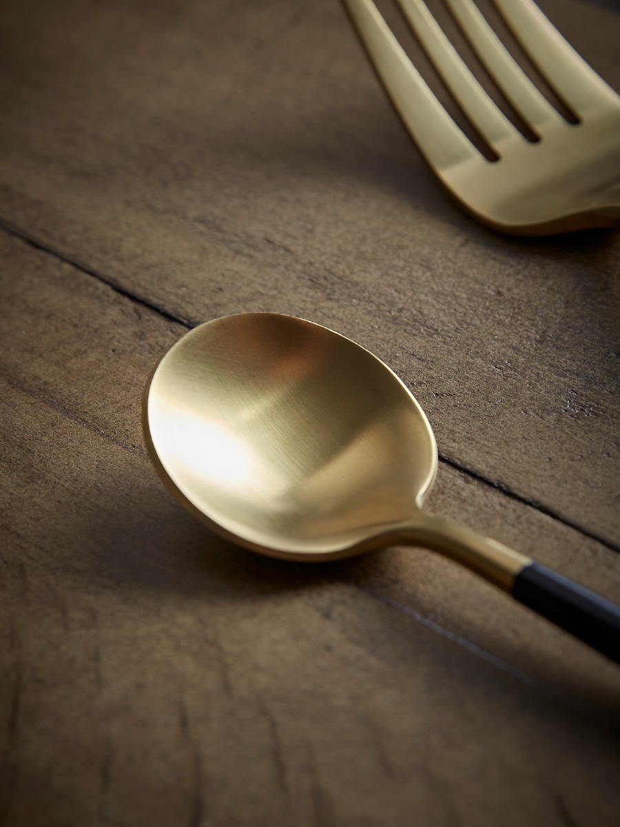 Product photograph of Sixteen Piece Cutlery Set - Black Gold from Cox and Cox.