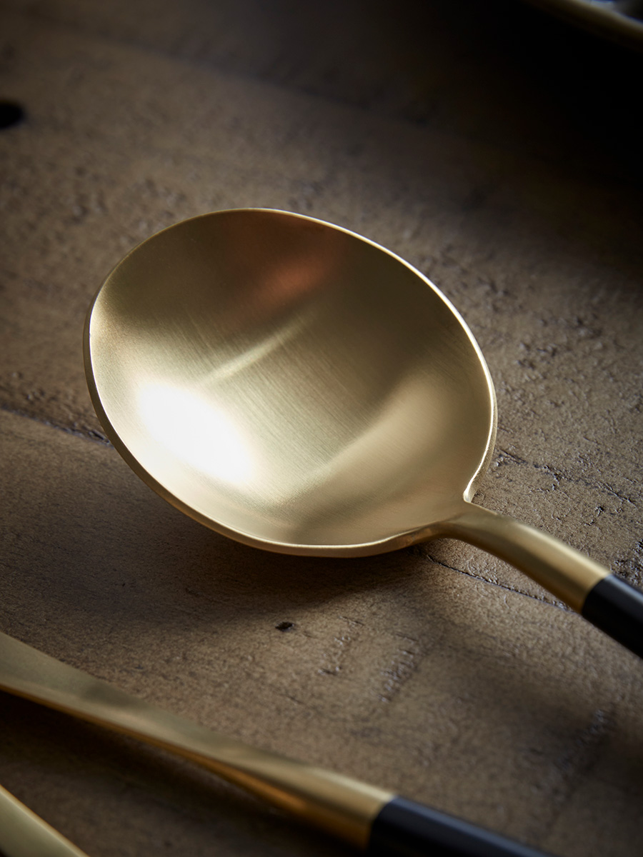 Product photograph of Sixteen Piece Cutlery Set - Black Gold from Cox and Cox.
