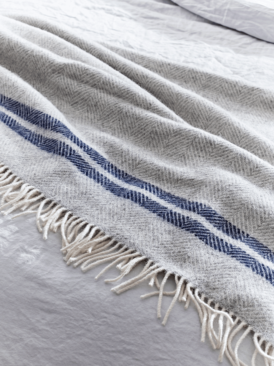 Product photograph of Soft Wool Throw - Blue French Stripe from Cox and Cox.