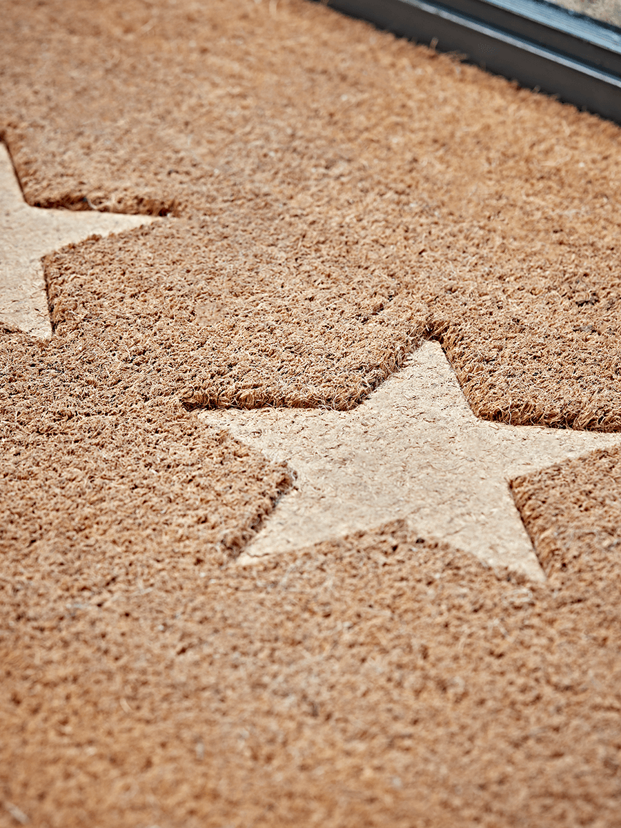 Product photograph of Embossed Stars Doormat - Double from Cox and Cox.