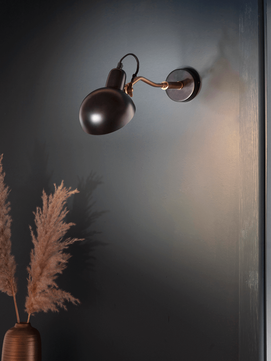 Photo of Industrial black & brass wall light