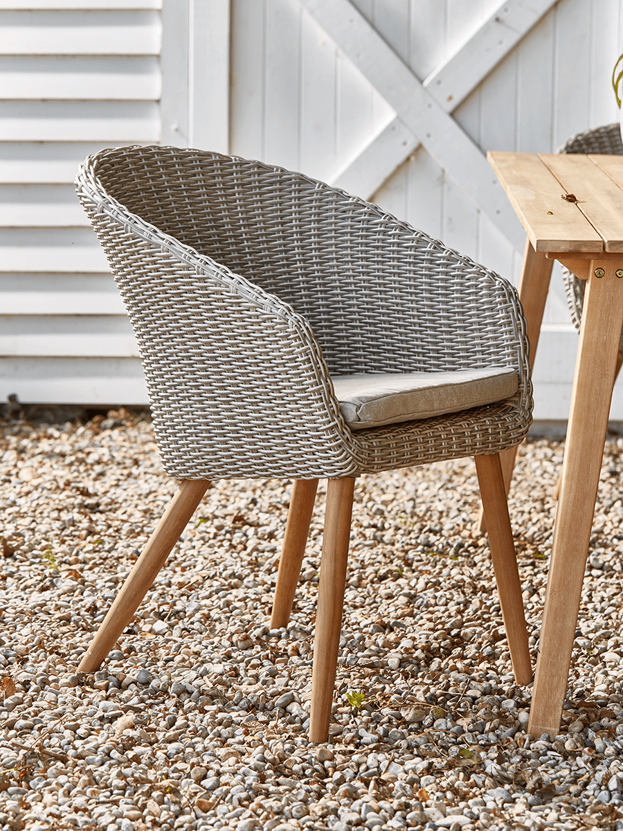 Product photograph of Two Faux Rattan Dining Chairs from Cox and Cox