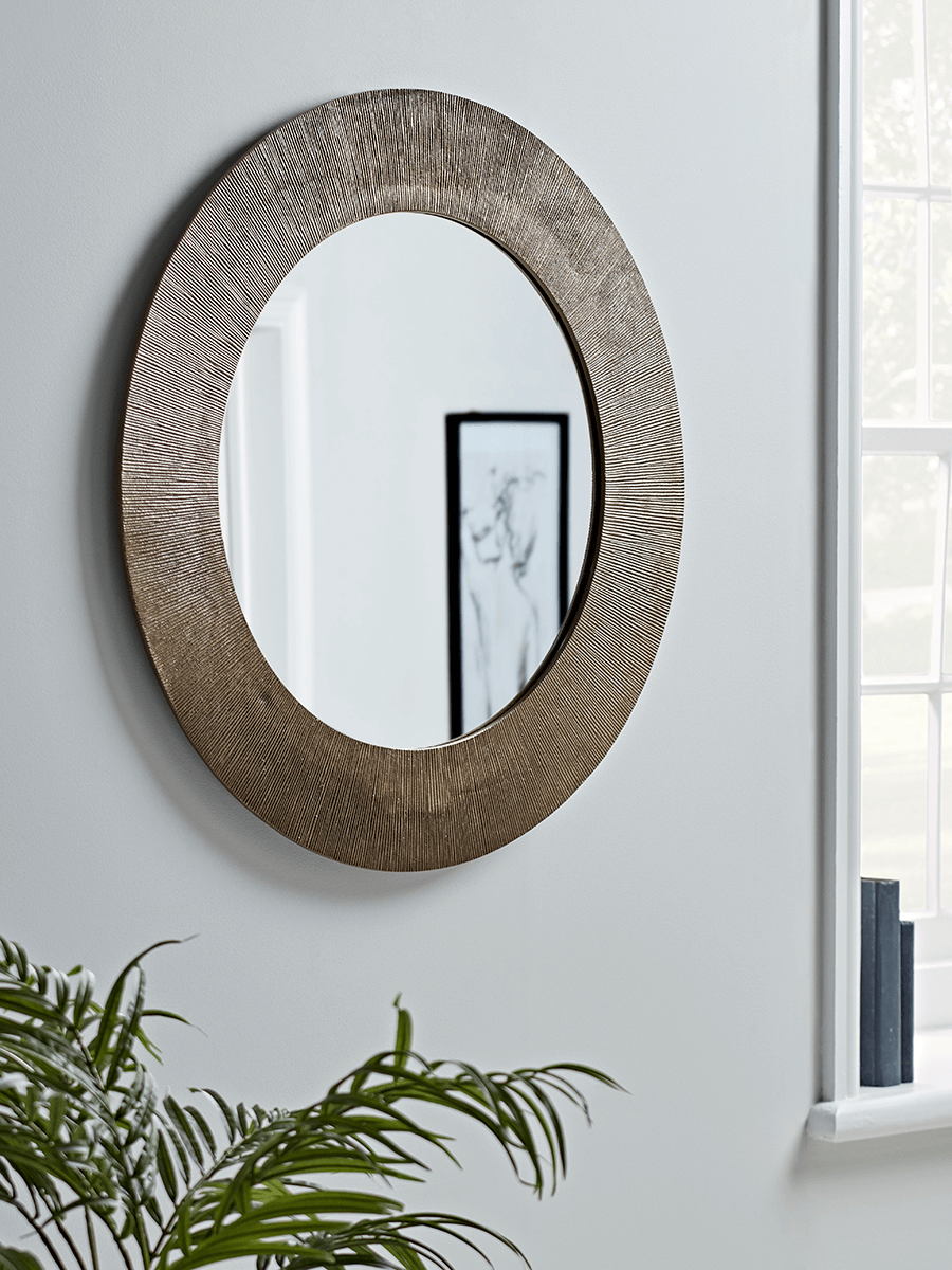 Product photograph of Antique Brass Wide Frame Round Mirror from Cox and Cox