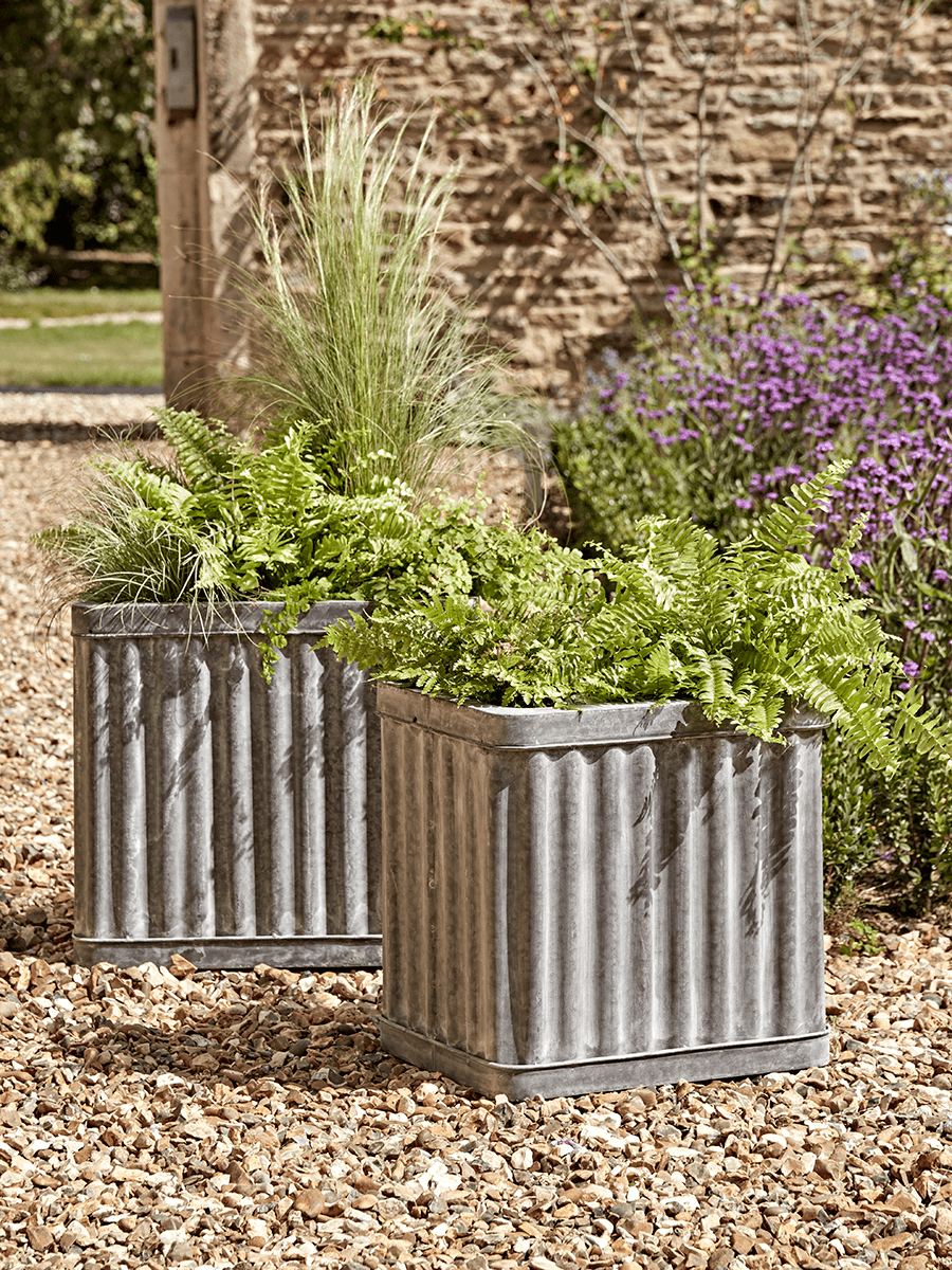 

Two Corrugated Zinc Planters