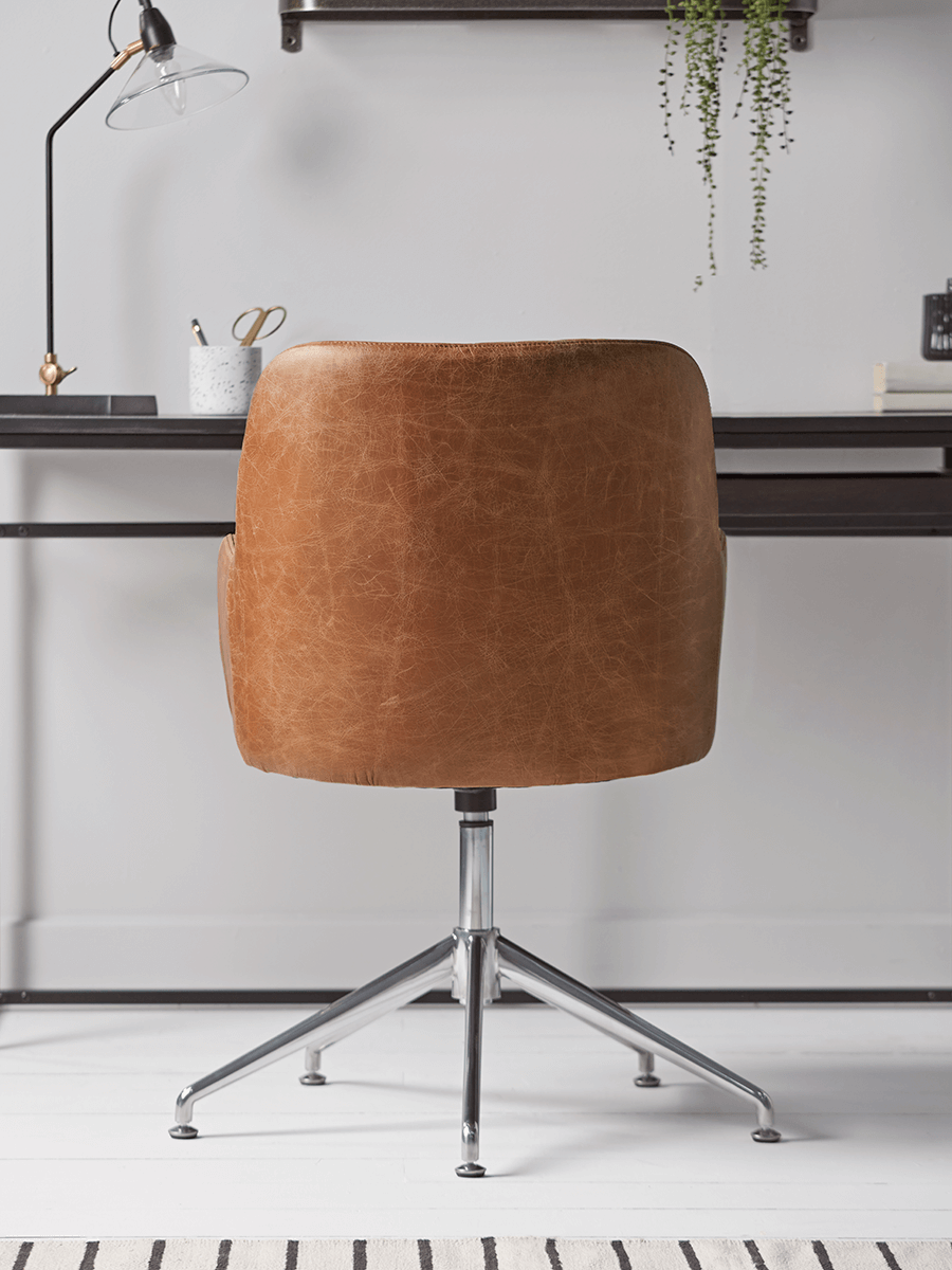 Product photograph of Fluted Leather Swivel Chair - Tan from Cox and Cox.