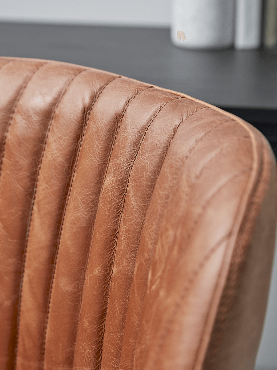 Product photograph of Fluted Leather Swivel Chair - Tan from Cox and Cox.