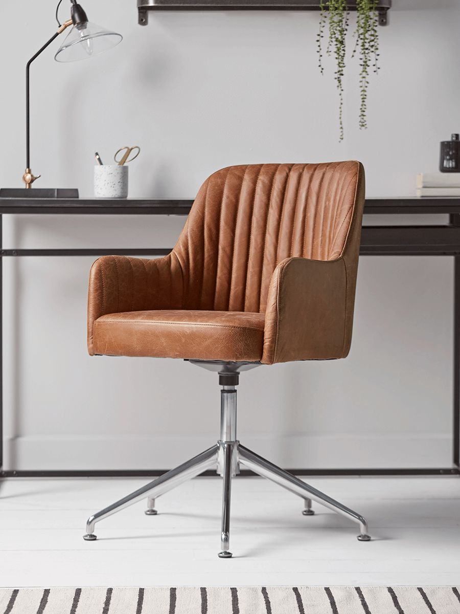 Product photograph of Fluted Leather Swivel Chair - Tan from Cox and Cox