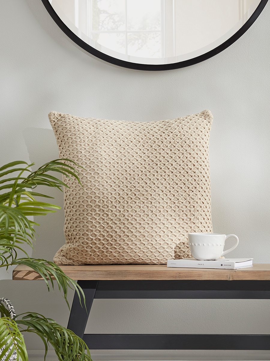 Photo of Diamond knitted cushion