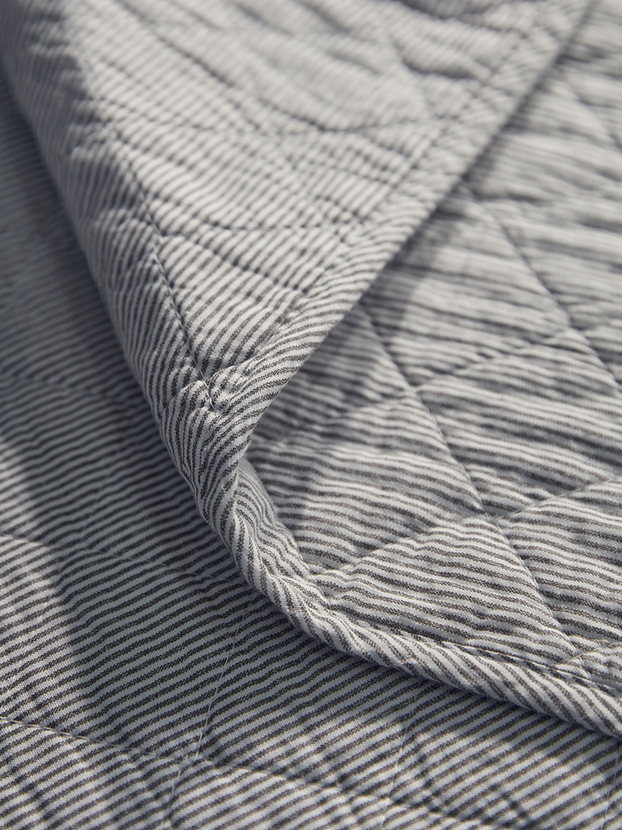 Product photograph of Cotton Black White Quilted Bedspread from Cox and Cox.