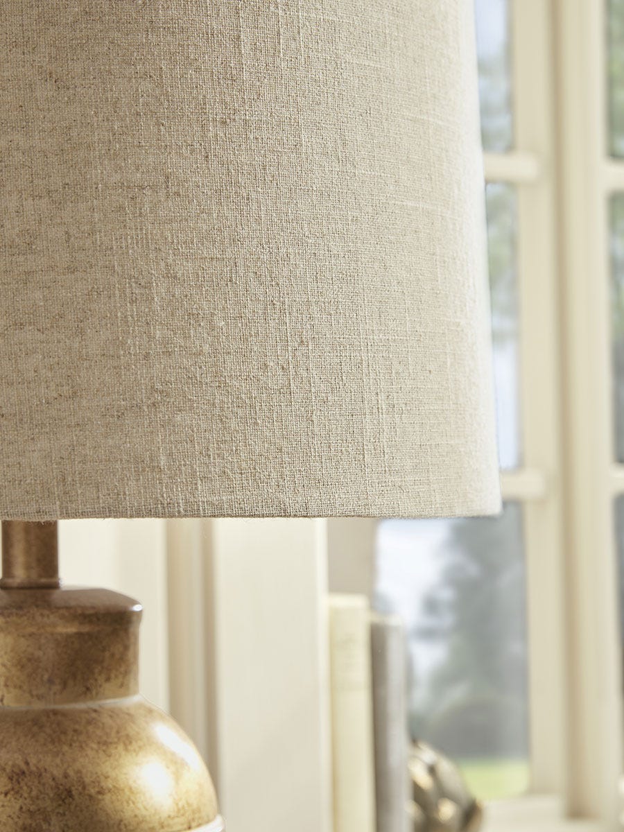 Product photograph of Aged Metal Table Lamp from Cox and Cox.