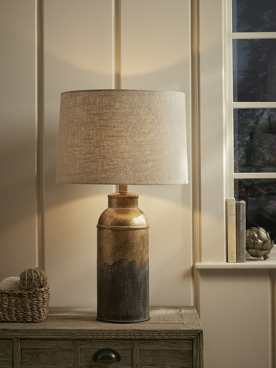 Product photograph of Aged Metal Table Lamp from Cox and Cox.