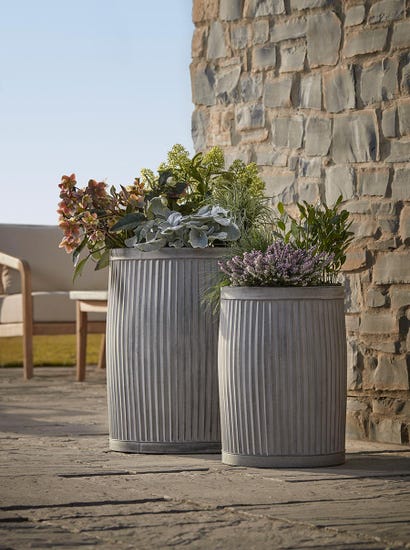 Two zinc Barrel Planters
